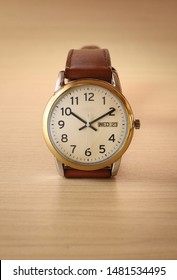 A wristwatch on a wooden table
