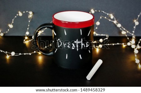 A writable mug with chalk message 