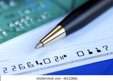 Write A Check To Pay The Credit Card Bill Isolated On Blue