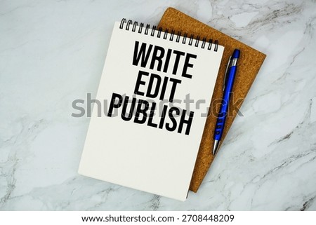 Write Edit Publish text written on notepad with pen on marble background