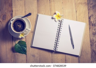 Write a note to a notebook and a cup of coffee