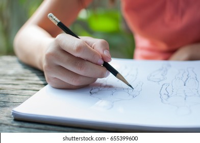 Write a note on a drawing sketchbook.