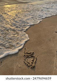 write our partner's initials in the beach sand because we always admire him wherever we are