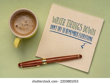 Write Things Down, Don't Try To Remember Everything - Inspirational Productivity Tip On A Napkin With A Cup Of Coffee