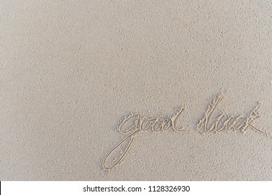 Write The Word Good Lucky On The Sand