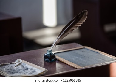 Writer vintage accessory: 
				retro inkwell, fountain pen and ink, feather quill pen, paperweight, bell, candlestick