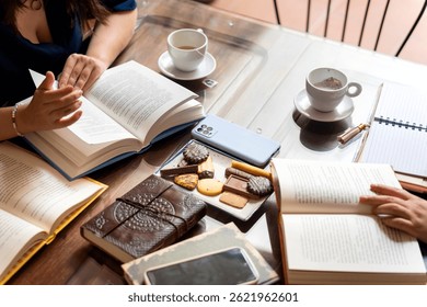 Writers enjoying tea and biscuits while discussing literature at a book club meeting, sharing ideas and insights