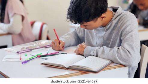 Writing, book and student in classroom for learning chemistry with notes for exam, test or project. Education, teenager and boy in lesson for studying science at school academy with scholarship.