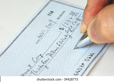 Writing A Check To Pay For  The Bill