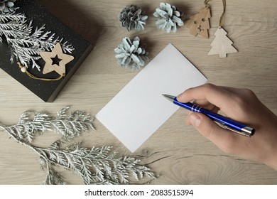 Writing Christmas Letter - Hand Writing A Letter. Preparation For The Holiday. DIY Holiday Handicraft Decorations. New Year And Christmas Background. Holidays Card. Copy Space.