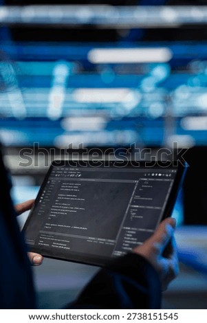 Writing code, tablet closeup and computer scientist in data center updating infrastructure network systems. Coding upgrades and worker typing on touchscreen device in server hub