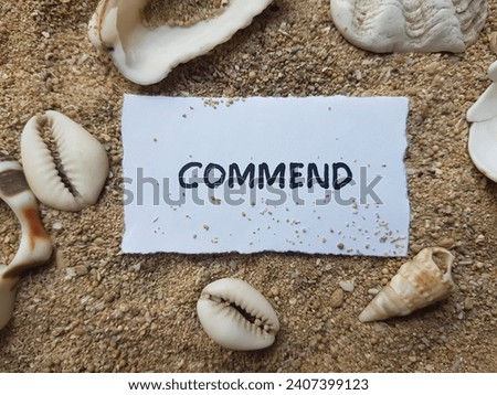The writing commend on the beach sand background.
