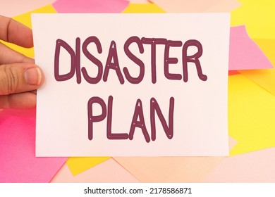 Writing Displaying Text Disaster Plan. Business Showcase Respond To Emergency Preparedness Survival And First Aid Kit Multiple Assorted Collection Office Stationery Photo Placed Over Table