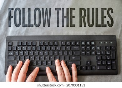 Writing displaying text Follow The Rules. Business overview go with regulations governing conduct or procedure Hands Pointing Pressing Computer Keyboard Enter Keys Typewriting New Ideas. - Shutterstock ID 2070331151