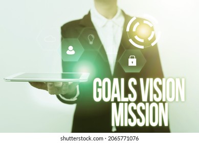 Writing Displaying Text Goals Vision Mission. Word For Practical Planning Process Used To Help Community Group Woman In Uniform Displaying Mobile Device Futuristic Virtual Tech.