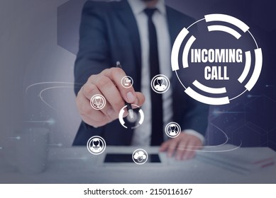 Writing displaying text Incoming Call. Business concept Inbound Received Caller ID Telephone Voicemail Vidcall Businessman in suit holding pen symbolizing successful teamwork.