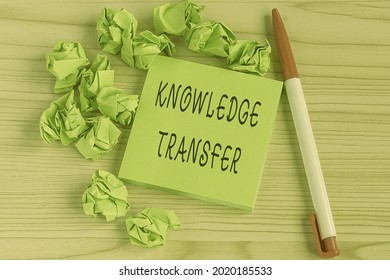 Writing Displaying Text Knowledge Transfer. Business Concept Sharing Or Disseminating Of Knowledge And Experience Multiple Assorted Collection Office Stationery Photo Placed Over Table