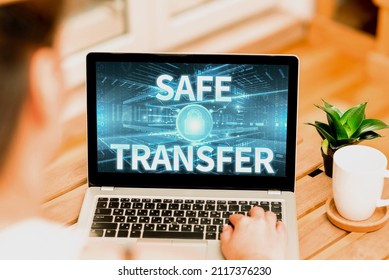 Writing displaying text Safe Transfer. Business idea transmitting the patient from a surface to a bed with care Woman Typing On Laptop Beside Coffe Mug And Plant Working From Home.