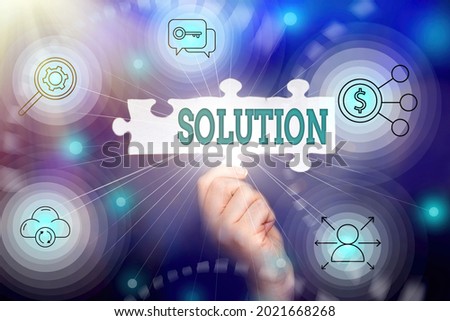Writing displaying text Solution. Business overview the ways to solve a problem or tackle a difficult situation Hand Holding Jigsaw Puzzle Piece Unlocking New Futuristic Technologies.