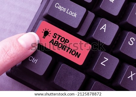 Writing displaying text Stop Abortion. Business approach advocating against the practice of abortion Prolife movement Downloading Online Files And Data, Uploading Programming Codes Stock photo © 