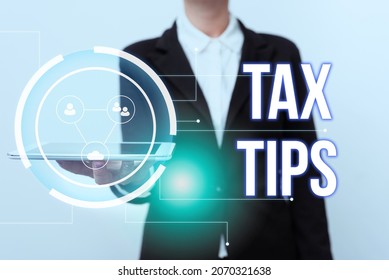 Writing Displaying Text Tax Tips. Business Approach Compulsory Contribution To State Revenue Levied By Government Woman In Uniform Displaying Mobile Device Futuristic Virtual Tech.