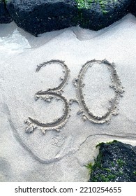 Writing Number 30 On Sand Texture. Beach, Rock, In Nature.