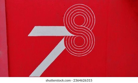 writing the number 78 on the wall - Shutterstock ID 2364626315