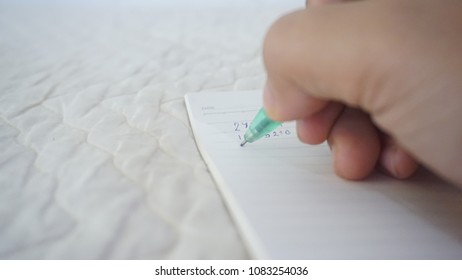 Writing on notebook