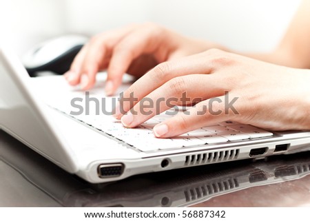 Writing on a white laptot