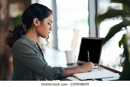 Writing, Serious And Freelance Young Woman Working With Laptop And Notebook At A Cafe. Creative Remote Worker Or Female Student Planning, Brainstorming A Mind Map About Future Career.