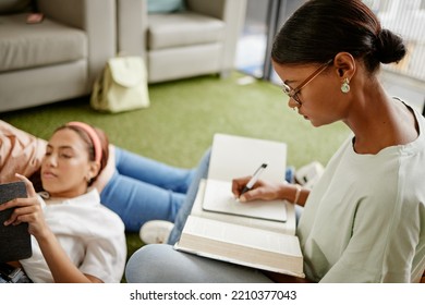 Writing, Studying And Woman Student Exam Learning With A Friend Busy With University Education. College Students Together With Diversity, Tired Study Burnout And Scholarship Work In A School Dorm