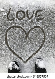 Writing Text LOVE On The Snow