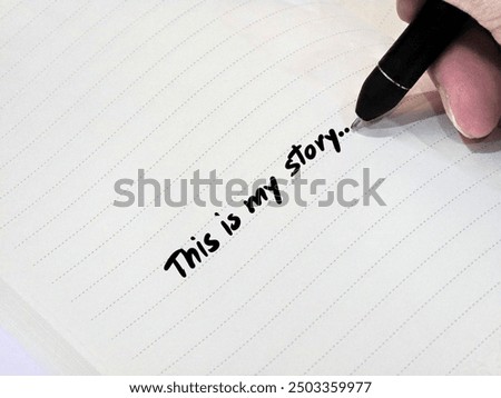 writing text on notebook concept, writing "This is my story" to pass on my story to other