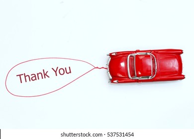 writing thank you red toy car with talk bubble on white background - Shutterstock ID 537531454