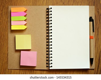 Writing Utensils On Wooden Table