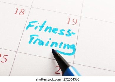 Written Plan Fitness Training  On Calendar Page Background