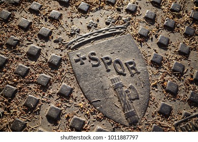 Written Spqr On Cast Iron Manhole In The Sun