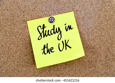 Written Text Study In The UK Over Yellow Paper Note Pinned On Cork Board