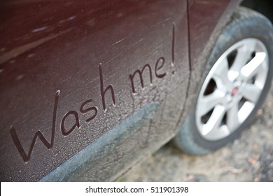 Written Text WASH ME On Dirty Car