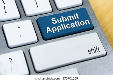 Written word Submit Application on blue keyboard button. Online Submission Concept