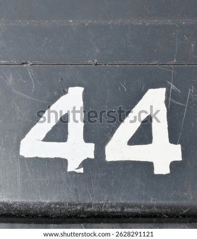 Written Wording in Distressed State Typography Found Ransom Number 44 Forty Four