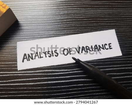 The writting analysis of variance on table background. 