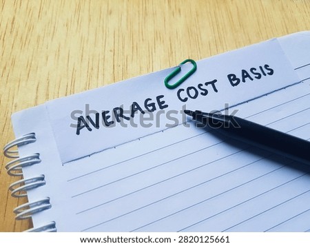 The writting average cost basis on table background. 