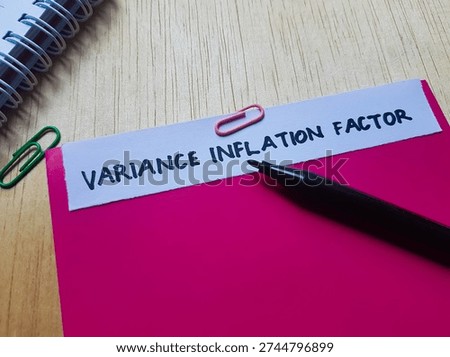 The writting variance inflation factor on table background. 