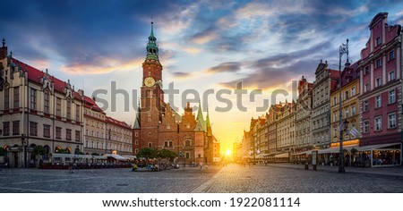 Wroclaw central market square with old houses and sunset. Panoramic evening view, long exposure, timelapse.  Historical capital of Silesia, Wroclaw (Breslau) , Poland, Europe.