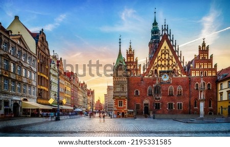 Wroclaw central market square with old houses and sunset. Panoramic evening view, long exposure, timelapse.  Historical capital of Silesia, Wroclaw (Breslau) , Poland, Europe.