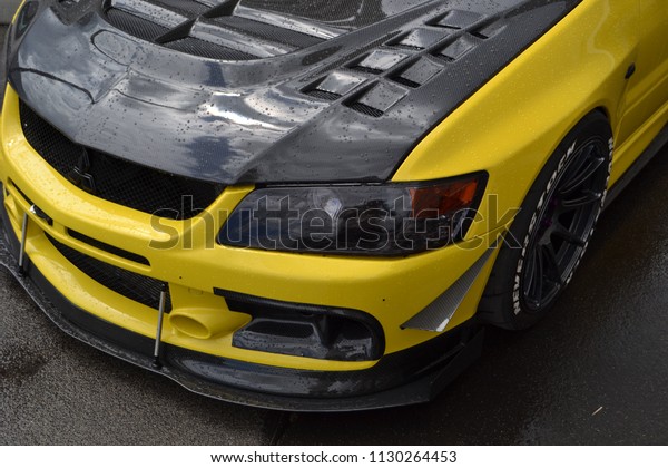 Wroclaw; Poland
- 07 02 2018: RACEISM event auto show. Yellow Mitsubishi Lancer
Evolution evo on stance car
show.