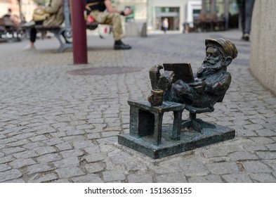 Wroclaw / Poland - April 21, 2019: Wroclaw Street Office Worker Dwarf With Laptop Bronze Statue.