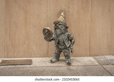 Wroclaw, Poland - Aug 20, 2019: Jany dwarf with a mirror (Janinek) - since 2005 hundreds of wroclaw dwarf figurines appeared in the city - Wroclaw, Poland