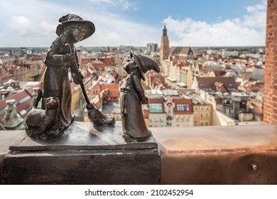 Wroclaw, Poland - Aug 21, 2019: Witches Tekla and Martynka dwarfs at Penitents Bridge of St. Mary Magdalene's Church (Czarownice Tekla i Martynka)